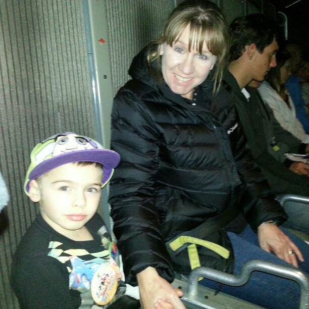 Van in his Buzz hat with Nana on Soaring Over California at Disneyland.